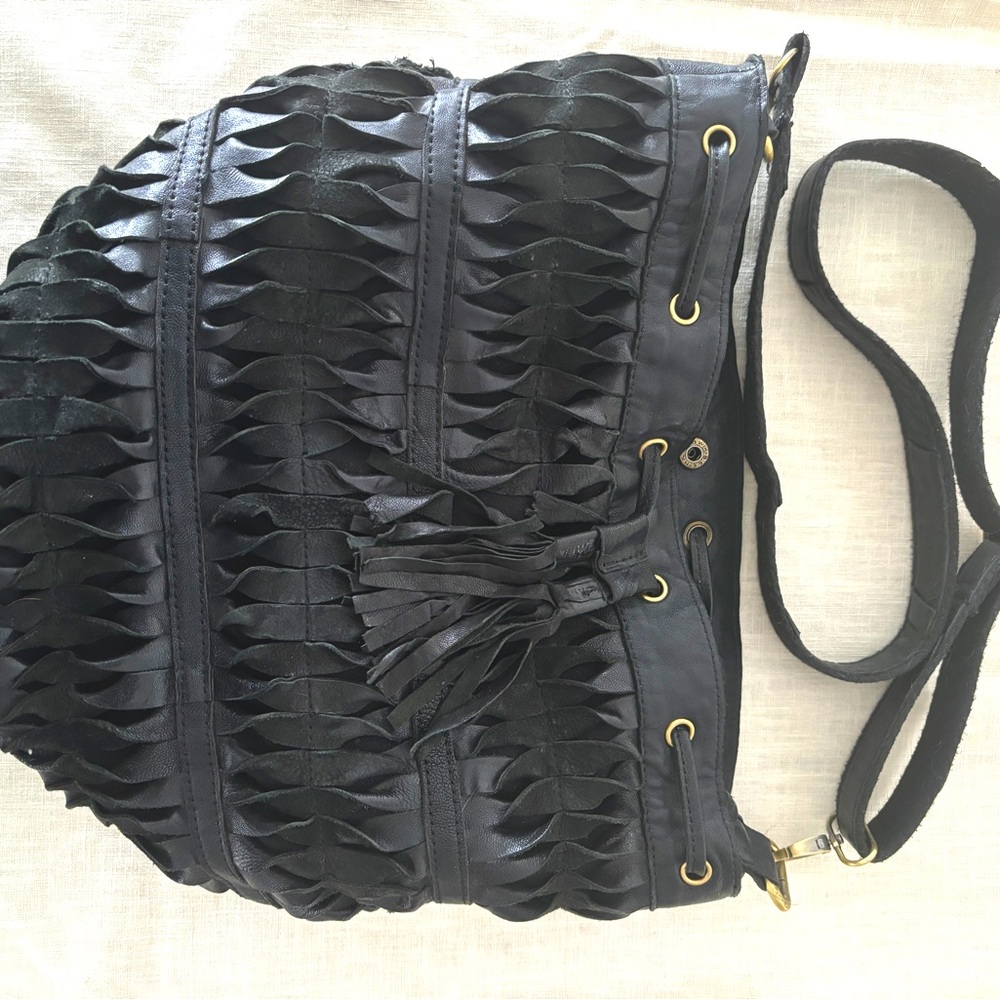 Black leather Lost & Found Brand bucket bag.